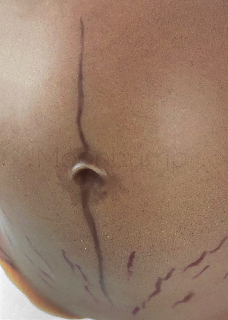 fake pregnant belly silicone detail linea nigra & stretch marks on chocolate brown skin
