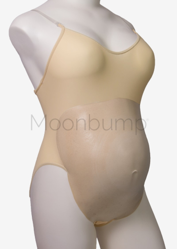 Foam fake pregnancy bump costume in Moonbump's F1 colour 'sand beige', shown on a mannequin